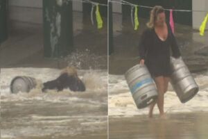 Guerreira: mulher se arrisca em tempestade e enchentes para salvar barris de cerveja