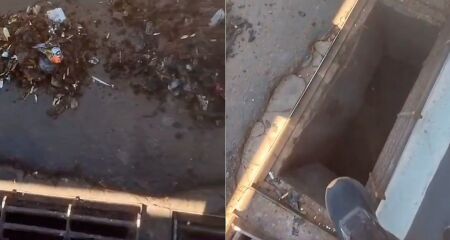 Sujeira retirada do bueiro após comerciante pagar pela limpeza