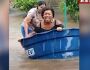 Transexual usa caixa d’água para escapar de enchente e salvar doguinhos (vídeo)