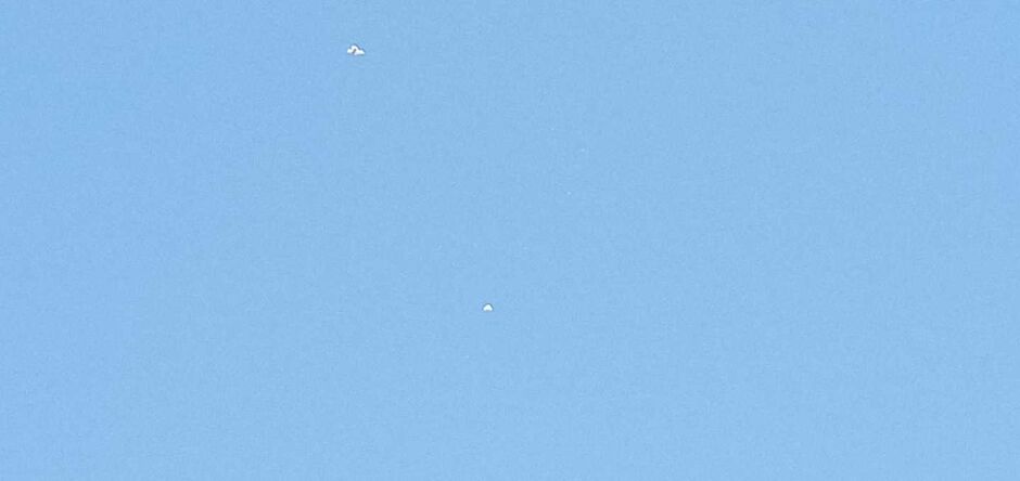 O que seria o ponto branco no céu visto pela pessoa?