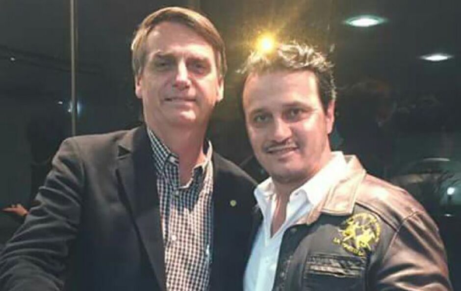 Marcos Henrique Derzi e Jair Bolsonaro, que o demitiu depois